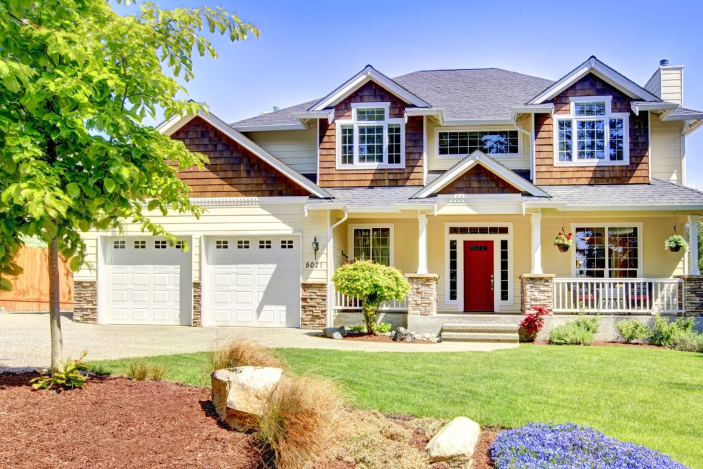 Large American beautiful house with red door