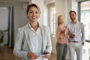 Portrait of happy female real estate agent. 